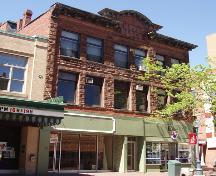 The original stonework of the façade remains on The Empire Block today.  Along with tenants in the second and third floor apartments, several commercial ventures currently occupy this building.; Moncton Museum