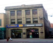 Front view showing recessed windows and brick detailing; City of Fredericton