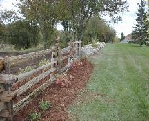View of the wooden and stone fences on the western most boundary of the Kindree Family Cemetery.; City of Mississauga