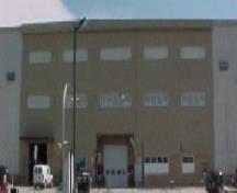 General view of Hangar 16, showing its simple geometric form and impressive rectangular massing, 2003.; Department of National Defence / Ministère de la Défense nationale, 2003.