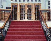 View of the interior of the Officers' Mess, showing the Art Deco-inspired stairwell and extensive wood panelling, 1994.; Department of National Defence / Ministère de la Défense nationale, 1994.