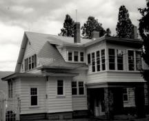 Façade of the Former Superintendent's Residence, showing the two-storey asymmetrically massed structure, with a gabled roof, 1989.; Parks Canada Agency / Agence Parcs Canada, 1989.