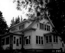 Corner view of the Former Superintendent's Residence, showing its wood construction, 1989.; Parks Canada Agency / Agence Parcs Canada, 1989.