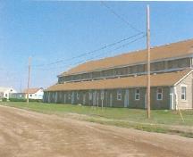 View of the exterior of the Recreational Hall, showing the roughly finished surface of the walls, 2003.; Department of National Defence / Ministère de la Défense nationale, 2003.