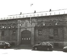 View of the Fusiliers Mont-Royal Armoury, showing its arched troop door, 1992.; Department of National Defence / Ministère de la Défense nationale, 1992.