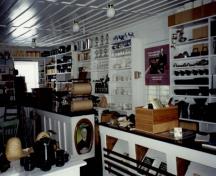 View of the interior of the St. Laurent Store and Warehouse, showing the built-in furnishings and all the other elements that evoke the former commercial use of the building, 1993.; Parks Canada Agency / Agence Parcs Canada, 1993.