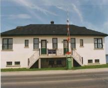 View of the main façade of Bridge Office and Shop, showing the symmetrical arrangement of windows and doors, 1993.; Department of Public Works / Ministère des Travaux publics, 1993.