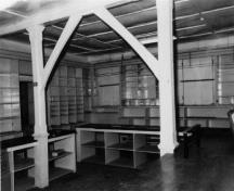 Interior view of the Ryan Retail Store, showing the shelves and counters in the sales area of the Retail store, 1991.; Agence Parcs Canada / Parks Canada Agency, 1991.