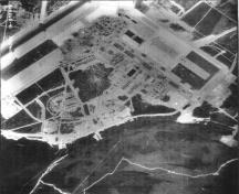 View of the Royal Canadian Air Force Base at Goose Bay, showing Hangar 8 at the top of the image, 1955.; Natural Resources Canada / Ressources naturelles Canada, Photo Library, A14865-41, 1955.