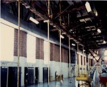 View of Hangar 77, showing the Warren trusses, 1995.; Ministère de la Défense nationale / Department of National Defence, 1995.