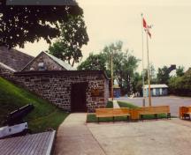 View of the main entrance of the Esplanade Powder Magazine, showing gable roof, 1989.; Parks Canada Agency / Agence Parcs Canada, 1989.