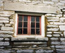Detail view of RMC Building 30a, showing a window with its dressed stone surrounds, 1993.; Parks Canada Agency / Agence Parcs Canada, 1993.