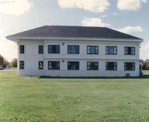 General view of Building B-37, showing the wrap-around continuity of the belt courses, 1993.; Parks Canada Agency / Agence Parcs Canada, 1993.