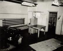 Historical photo of the interior of the Fortress Plotting Room depicting the large central room where the plotter was positioned, 1943.; FRH Photo Collection