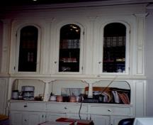 Interior view of Louis S. St-Laurent House, showing the formal and functional interior features associated with the residency of Louis S. St-Laurent, in particular the cupboards and china cabinet with glazed openings, 2000.; Christine Chartré, Parks Canada Agency / Agence Parcs Canada, 2000.