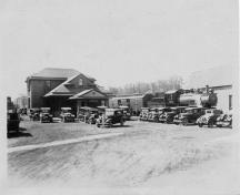 Image of the York Street Train Station showing rolling stock and cars parked in the railway yard, taken circa 1940's; Private Collection