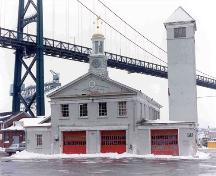HMC Dockyard Clock on dockyard fire hall, Halifax Dockyards, Halifax, Nova Scotia, 1986.; HMC Dockyard, base photographic section, CFB Halifax, Halifax, NS, 1986.