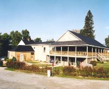 View of an exterior 1-storey sandstone wing attached at the back of the house.; PNB 2005