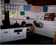 Interior view of the Byng Warden Patrol Cabin, showing the walls of horizontally laid peeled logs, 1997.; Parks Canada Agency / Agence Parcs Canada, 1997.
