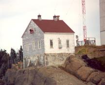 View of the exterior of the Light Station: Fog Alarm, showing the elements that distinguish it from a dwelling, including the absence of ornamental detail, 1996.; Parks Canada Agency / Agence Parcs Canada, 1996.