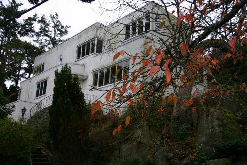 Oblique view of front (northeast) facade