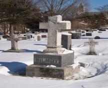 Image of the cemetery showing the grave stone of Robert Duncan Wilmot in the foreground.; Town of Oromocto