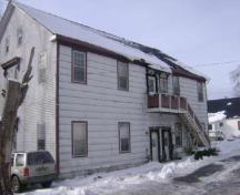 This photograph shows a contextual view of the old school, 2009; Town of St. Andrews