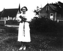 Cette image, prise vers 1934, montre le musée Orange Hall sur son site d'origine de l'autre côté du chemin de son emplacement actuel; Queens County Heritage Collection