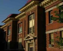 Characteristic dentiled cornice and decorative brickwork of Mutchmor Public School, 2009.; 