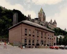 Front view of the Old Québec Custom House, showing the regular placement and size of windows, unframed and set within blind arcading on the ground floor, and set in moulded frames of cut stone on the second, 2003.; Parks Canada Agency / Agence Parcs Canada, 2003.