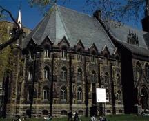 Side view of St. James United Church's apse showing the surviving original exterior materials, including stone, stained-glass windows, and slate roofing.; Parks Canada Agency / Agence Parcs Canada, C. Turnel, n.d.