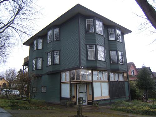 Front and east sides seen from sidewalk at corner