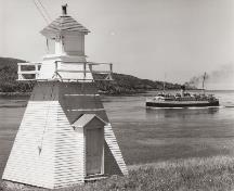 Historic photograph showing Princess Helene passing Victoria Beach Lighthouse; Nova Scotia Archives \ Archives de la Nouvelle-Écosse, no. NSIS 11529