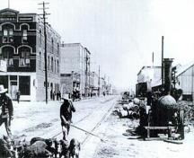 Chinese men on Front Street herding pigs, circa 1904.Vancouver Public Library #6749,  New Westminster Public Library #5; Vancouver Public Library #6749, New Westminster Public Library #5