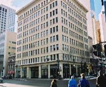 View of the McLeod Building from the northeast showing the lower part of the two main, terracotta-clad facades. The Chicago-style influence is apparent in the tri-partite arrangement of base, shaft and capital in the facade composition. (2004); City of Edmonton, 2004