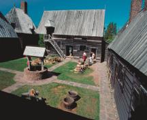 General view of the Port-Royal demonstrating the grouping of structures around an inner courtyard within the stockade, 1990.; Parks Canada Agercy/ Agence Parcs Canada, B. Pratt
