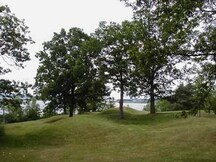 General view of Serpent Mounds, showing a grouping of burial mounds forming a serpentine shape, 2006.; Parks Canada Agency / Agence Parcs Canada, 2006.