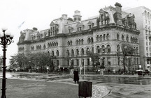 General view of the Office of the Prime Minister and Privy Council, showing its well-designed and richly detailed exterior, executed in the Second Empire style, with traces of the Romanesque influence, 1987.; Ian Doull, AHB, Parks Canada Agency / Agence Parcs Canada, 1987