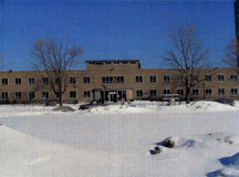 General view of the Health Protection Building, showing its clean horizontal lines and simple two-storey massing, 2004.; Parks Canada Agency / Agence Parcs Canada, 2004.