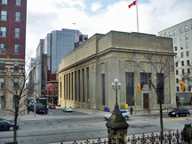 Corner view of the Bank of Montreal, showing its monumental massing designed in the traditional temple form, 2011.; Parks Canada Agency / Agence Parcs Canada, M. Therrien, 2011.