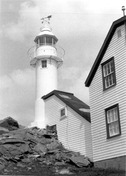 Lobster Cove Head Lighthouse, showing the lightkeeper's house, 1988.; Parks Canada Agency/Agence Parcs Canada, 1988.