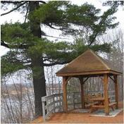Picnic shelter on north shore of Wolastoq, overlooking Kani Uten; Parks Canada / Parcs Canada