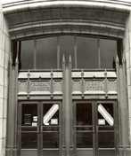 Detail view of the Federal Building, showing the gothic detailing around the main entrance, 1983.; Parks Canada Agency / Agence Parcs Canada, M. Caraffe, 1983.