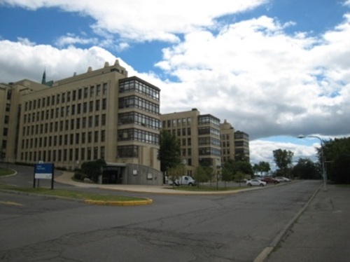 Central portion with east wings and solariums