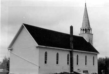 Vue générale de l’église Saint-Antoine-de-Padoue, montrant les façades à l'ouest et au nord; Parks Canada | Parcs Canada, 1982