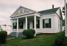 General view of the Charlotte County Court House, showing its classical features and detailing, including an elaborate pedimented portico with decorative mouldings, 2003.; Parcs Canada | Parks Canada, 2003.