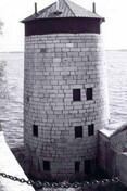 General view of Branch Tower East, showing the simple geometric massing of the massive ashlar faced circular tower, 1996.; Parks Canada | Parcs Canada, Graham, 1996