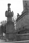 Detail view of Brock's Monument, showing a military trophy of classical armour, 1989.; Parks Canada | Parcs Canada, 1989.