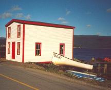 Exterior photo of landward and side facade of Roberts Store, showing Woody Point Harbour.; Town of Woody Point 2005
