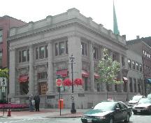 This photograph shows the contextual view of the building and its proximity to the other buildings on King and Germain Street as well as the vault building added on to the Germain Street façade at a later date, 2004; City of Saint John